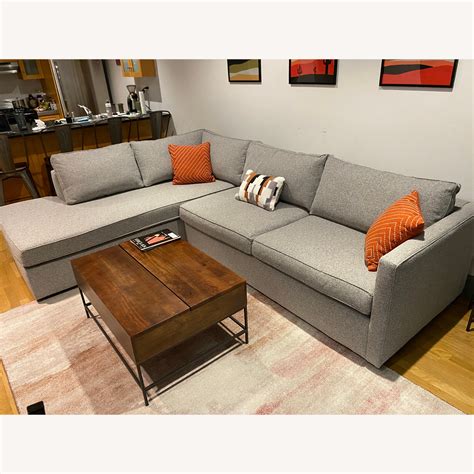 A deep, comfy seat and low padded arms give it an incredible sink-right-in quality. . West elm harris sectional